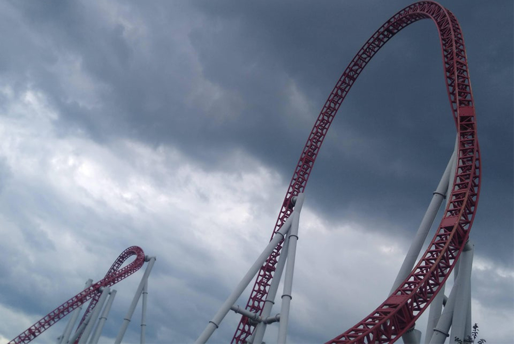 Interlink Blog : Rollercoaster surrounded by dark clouds image